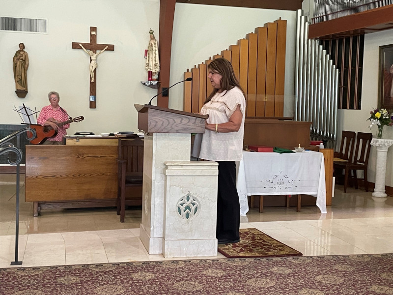 Ms.-Carmen-reads-at-grad-mass