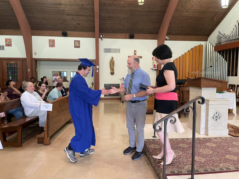 Vinny-graduates-shake-hand